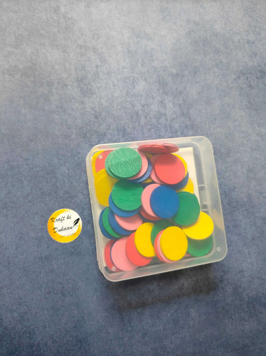 Craft wood coin set in clear box with multicolor coins, viewed from above